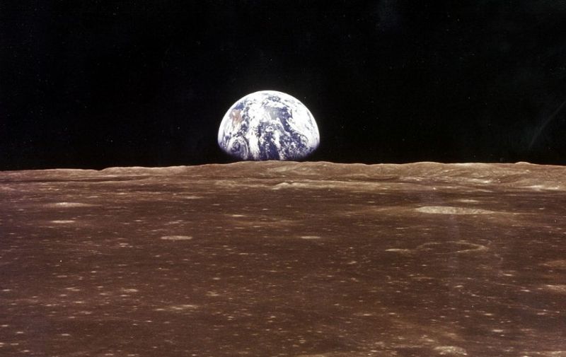 (FILES) This 19 July 1969 file photo released by NASA shows the Earth as seen from the Apollo 11 command module as it orbits the Moon during before the landing of the lunar module. The 20th July 1999 marks the 30th anniversary of the Apollo 11 mission and man's first walk on the Moon. AFP PHOTO   NASA