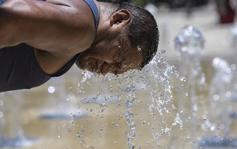 A man cools off at a water fountain in the Monumento a la Revolucion square during a heat wave that hits Mexico City on April 16, 2024. Nearly all of Mexico has been hit by the heatwave, and in eight states with coastlines on the Pacific and the Gulf of Mexico, temperatures are forecast to exceed 45 degrees Celsius. (Photo by Yuri CORTEZ / AFP)