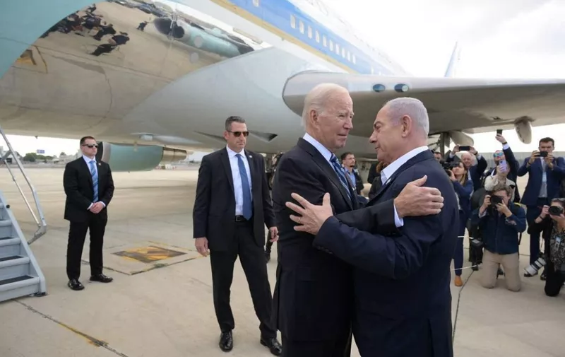 TEL AVIV, ISRAEL - OCTOBER 18: (----EDITORIAL USE ONLY - MANDATORY CREDIT - 'ISRAELI GOVERNMENT PRESS OFFICE (GPO) / HANDOUT' - NO MARKETING NO ADVERTISING CAMPAIGNS - DISTRIBUTED AS A SERVICE TO CLIENTS----) US President Joe Biden is welcomed by Prime Minister Benjamin Netanyahu (R) at the Ben Gurion Airport in Tel Aviv, Israel on October 18, 2023. GPO/ Handout / Anadolu (Photo by GPO/ Handout / ANADOLU / Anadolu via AFP)