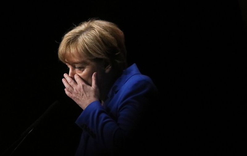 German Chancellor Angela Merkel gestures as she speaks at the annual meeting of the Rhineland-Palatinate business council in Mainz on January 11, 2016. / AFP / dpa / Fredrik von Erichsen / Germany OUT