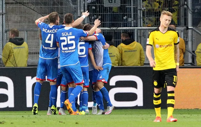 Hoffenheim's players celebrate Hoffenheim's midfielder Sebastian Rudy scoring the 1-0 during the German first division Bundesliga football match TSG 1899 Hoffenheim vs Borussia Dortmund in Sinsheim, on September 23, 2015.    

RESTRICTIONS: DURING MATCH TIME: DFL RULES TO LIMIT THE ONLINE USAGE TO 15 PICTURES PER MATCH AND FORBID IMAGE SEQUENCES TO SIMULATE VIDEO. 
==RESTRICTED TO EDITORIAL USE ==
FOR FURTHER QUERIES PLEASE  CONTACT THE  DFL DIRECTLY AT + 49 69 650050.