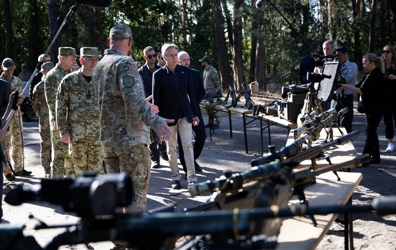 US Secretary of State Antony Blinken looks at weapons while he tours a State Border Guard of Ukraine Detached Commandant Office of Security and Resource Supply site September 7, 2023, in the  Kyiv Oblast. Top US diplomat Antony Blinken announced over $1 billion of new assistance to Ukraine during a visit to Kyiv on September 6, 2023, in a package he said would help Ukraine's counteroffensive "build momentum". (Photo by Brendan Smialowski / POOL / AFP)
