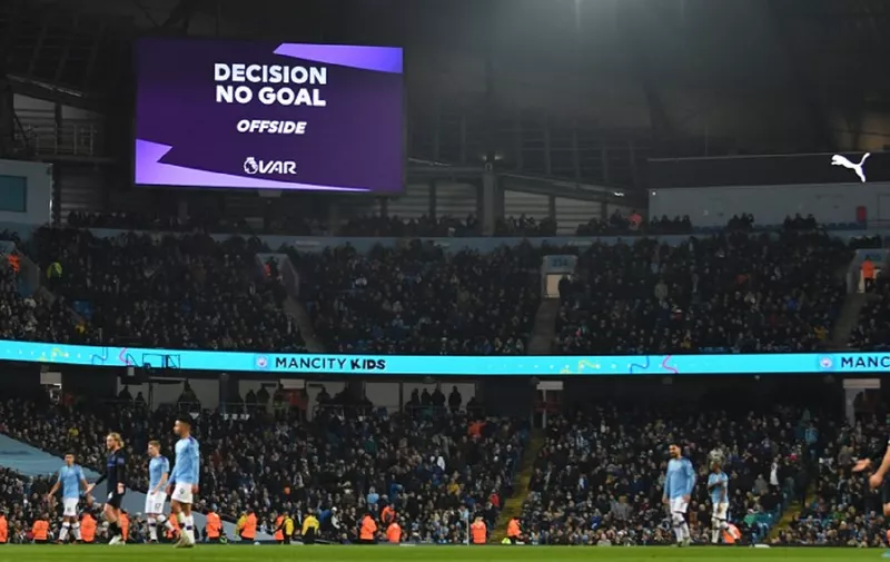 The scoreboard shows the VAR (Video Assistant Referee) decision of offside against a goal scored by Manchester City's English midfielder Phil Foden during the English Premier League football match between Manchester City and Everton at the Etihad Stadium in Manchester, north west England, on January 1, 2020. (Photo by Paul ELLIS / AFP) / RESTRICTED TO EDITORIAL USE. No use with unauthorized audio, video, data, fixture lists, club/league logos or 'live' services. Online in-match use limited to 120 images. An additional 40 images may be used in extra time. No video emulation. Social media in-match use limited to 120 images. An additional 40 images may be used in extra time. No use in betting publications, games or single club/league/player publications. /