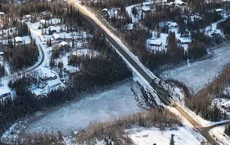 This image obtained from the US Department of Defense and taken by the US Air National Guard, shows an aerial view of damage to a road in Alaska from the November 30, 2018, earthquake. - The powerful earthquake rocked Anchorage on Friday, violently shaking homes and businesses, sending scared residents into the streets and damaging buildings in Alaska's largest city. The 7.0-magnitude quake struck at 8:29 am (1729 GMT), in the middle of the school run and as workers were heading out for the day. (Photo by - / Air National Guard / AFP) / RESTRICTED TO EDITORIAL USE - MANDATORY CREDIT "AFP PHOTO / US Air National Guard" - NO MARKETING NO ADVERTISING CAMPAIGNS - DISTRIBUTED AS A SERVICE TO CLIENTS