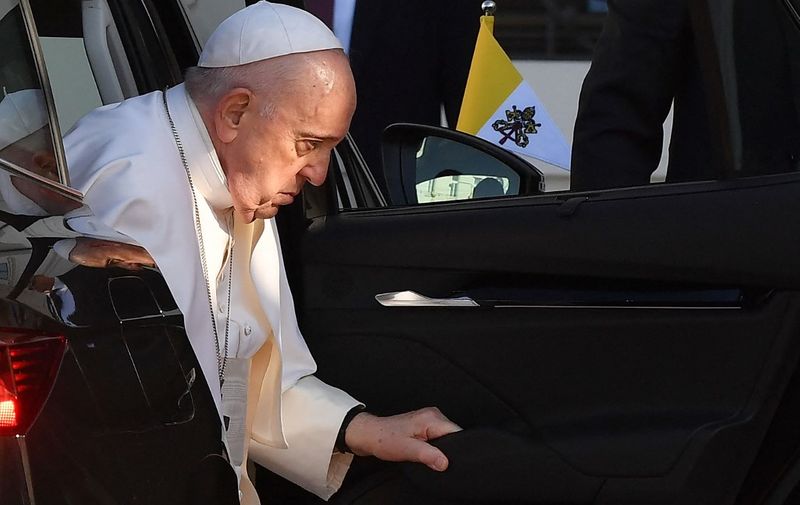 Pope Francis gets out of a car as he arrives for a welcoming ceremony at the Presidential Palace in Bratislava, Slovakia on September 13, 2021. - The Pope is on a four-day visit in Slovakia, where he will meet with Holocaust survivors and members of the Roma community. (Photo by Tiziana FABI / AFP)