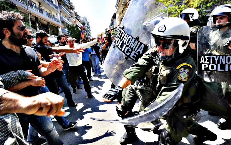 Police clash with protesters at the annual rally to protest the mass killings of Armenians in Ottoman Turkey nearly a century ago in Thessaloniki, Greece on Wednesday April 24, 2013. About 250 protesters, mostly from Greek-Armenian groups, gathered outside the Turkish consulate. About 20 countries worldwide, including Greece, as well as the European parliament recognize the mass killings as an act of genocide, despite strong objections from Turkey. (AP Photo/Nikolas Giakoumidis)
