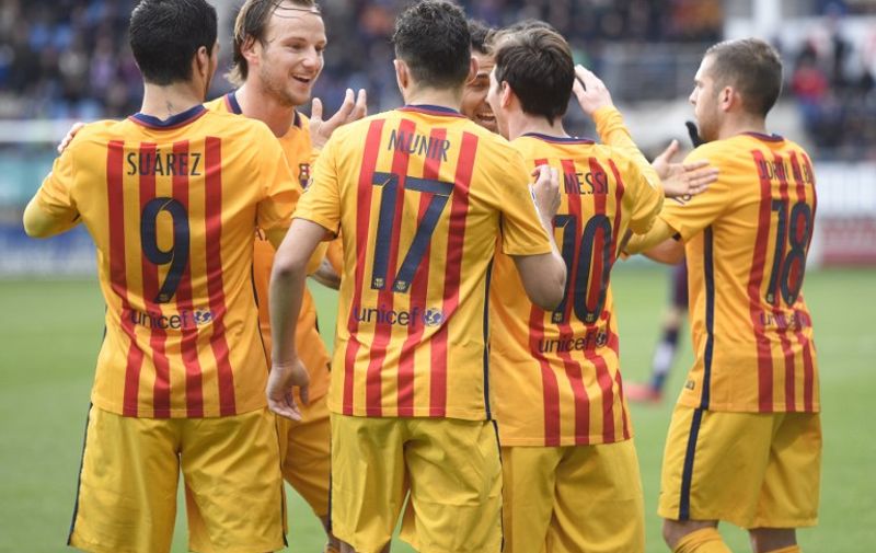 Barcelona players celebrate their second goal during the Spanish league football match SD Eibar vs FC Barcelona at the Ipurua stadium in Eibar on March 6, 2016.
Barcelona's Argentinian forward Lionel Messi scored the second goal. / AFP / ANDER GILLENEA / The erroneous mention[s] appearing in the metadata of this photo by ANDER GILLENEA has been modified in AFP systems in the following manner: [ADDING CODE FOR LIVE REPORT]. Please immediately remove the erroneous mention[s] from all your online services and delete it (them) from your servers. If you have been authorized by AFP to distribute it (them) to third parties, please ensure that the same actions are carried out by them. Failure to promptly comply with these instructions will entail liability on your part for any continued or post notification usage. Therefore we thank you very much for all your attention and prompt action. We are sorry for the inconvenience this notification may cause and remain at your disposal for any further information you may require.