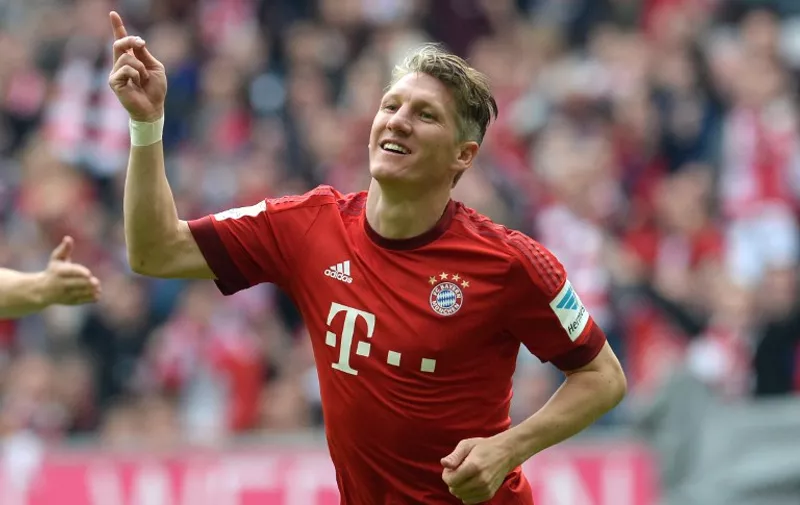 Bayern Munich's midfielder Bastian Schweinsteiger celebrates after the second goal for Munich during German first division Bundesliga football match FC Bayern Munich vs 1 FSV Mainz 05 at the Allianz Arena in Munich, southern Germany on May 23, 2015.  AFP PHOTO / CHRISTOF STACHE

RESTRICTIONS - DFL RULES TO LIMIT THE ONLINE USAGE DURING MATCH TIME TO 15 PICTURES PER MATCH. IMAGE SEQUENCES TO SIMULATE VIDEO IS NOT ALLOWED AT ANY TIME. FOR FURTHER QUERIES PLEASE CONTACT DFL DIRECTLY AT + 49 69 650050.