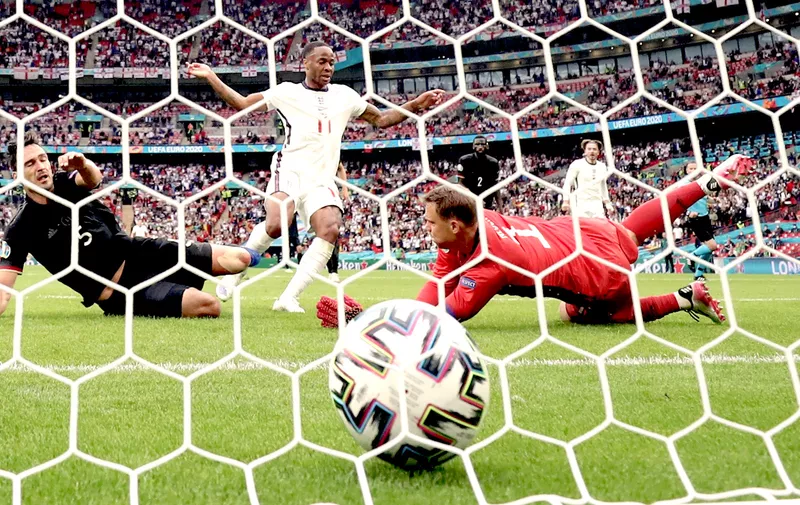 Soccer Football - Euro 2020 - Round of 16 - England v Germany - Wembley Stadium, London, Britain - June 29, 2021 England's Raheem Sterling scores their first goal past Germany's Manuel Neuer REUTERS/Carl Recine