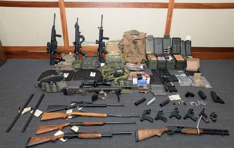 This undated image released by the US Attorney's Office on February 20, 2019, shows weapons seized at the Silver Spring, Maryland, home of US Coast Guard officer Christopher Paul Hasson. - Hasson, who espoused white supremacist views and drafted a target list of Democratic politicians and prominent media figures, has been arrested on firearms and drug charges. Hasson, an admirer of Norwegian mass murderer Anders Breivik, was arrested last week and a powerful arsenal seized from his home, according to court documents unsealed on February 20. "The defendant intends to murder innocent civilians on a scale rarely seen in this country," US District Attorney Robert Hur said in a motion seeking that Hasson be detained until trial. (Photo by HO / AFP) / RESTRICTED TO EDITORIAL USE - MANDATORY CREDIT "AFP PHOTO / US Attorney's Office" - NO MARKETING NO ADVERTISING CAMPAIGNS - DISTRIBUTED AS A SERVICE TO CLIENTS
