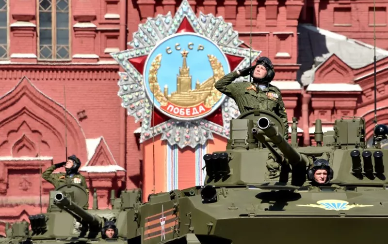 Russian BMD-4M Sadovnitsa infantry fighting vehicles ride through Red Square in Moscow, on May 7, 2015, during a rehearsal for the Victory Day military parade. Russia will celebrate the 70th anniversary of the 1945 victory over Nazi Germany on May 9. AFP PHOTO / KIRILL KUDRYAVTSEV