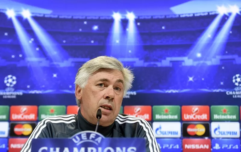 Real Madrid's Italian coach Carlo Ancelotti speaks during a press conference at Valdebebas training ground in Madrid on May 12, 2015, on the eve of the UEFA Champions League semi-final second leg football match Real Madrid CF vs Juventus.  AFP PHOTO/ GERARD JULIEN