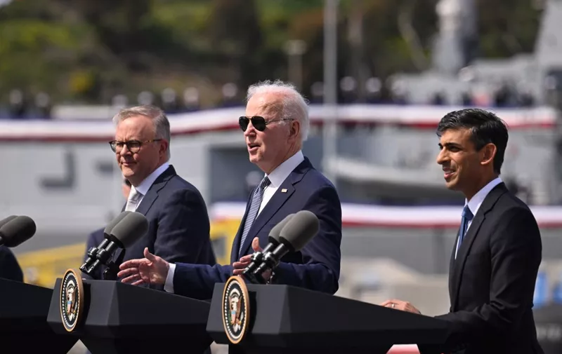 US President Joe Biden (C) speaks alongside British Prime Minister Rishi Sunak (R) and Australian Prime Minister Anthony Albanese (L) at a press conference during the AUKUS summit on March 13, 2023, at Naval Base Point Loma in San Diego California. - AUKUS is a trilateral security pact announced on September 15, 2021, for the Indo-Pacific region. (Photo by Jim WATSON / AFP)