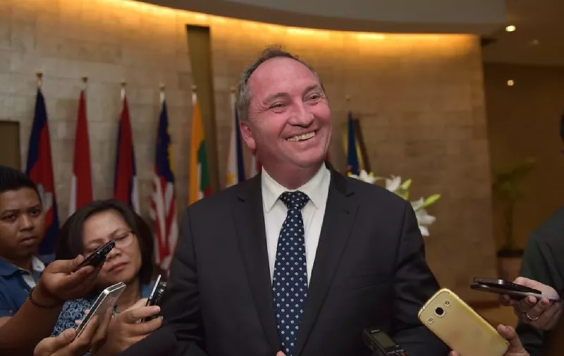 Australia's Agriculture Minister Barnaby Joyce (C) speaks to journalists after meeting with Indonesia's Trade Minister Thomas Lembong (not pictured) at the Trade Ministry office in Jakarta on October 8, 2015. Joyce was in Jakarta to strengthen agricultural ties between the two countries.   AFP PHOTO / ADEK BERRY / AFP PHOTO / ADEK BERRY
