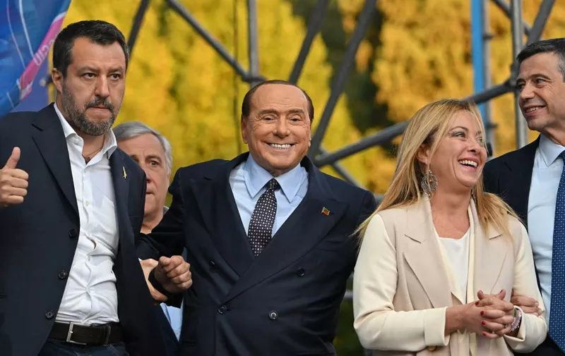 (From L) Leader of Italian far-right Lega (League) party Matteo Salvini, Forza Italia leader Silvio Berlusconi, leader of Italian far-right party "Fratelli d'Italia" (Brothers of Italy) Giorgia Meloni, and Italian centre-right lawmaker Maurizio Lupi stand on stage on September 22, 2022 during a joint rally of Italy's coalition of far-right and right-wing parties Brothers of Italy (Fratelli d'Italia, FdI), the League (Lega) and Forza Italia at Piazza del Popolo in Rome, ahead of the September 25 general election. (Photo by Alberto PIZZOLI / AFP)