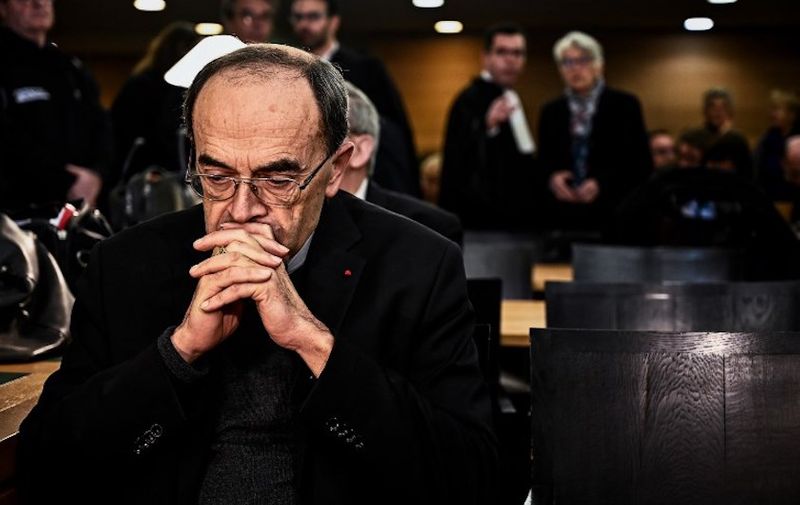 (FILES) In this file photo taken on January 07, 2019 Lyon archbishop, cardinal Philippe Barbarin is seen in the Lyon court to attend his trial, on January 7, 2019, charged with failing to report a priest who abused boy scouts in the 1980s and 1990s. - The archbishop of Lyon, the most senior French Catholic cleric caught up in the paedophilia scandals that have rocked the church, was convicted of helping covering up abuse and handed a six-month suspended jail term on March 7, 2019. (Photo by JEFF PACHOUD / AFP)