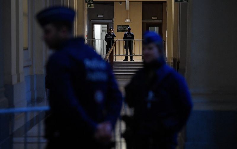 Belgian police stands outside the Palace of Justice in Brussels on January 19, 2023. - The so-called "Qatargate" corruption scandal has grabbed international headlines as a Belgian probe has seen MEP's homes raided, bags full of cash uncovered and senior lawmaker Eva Kaili detained. (Photo by John THYS / AFP)