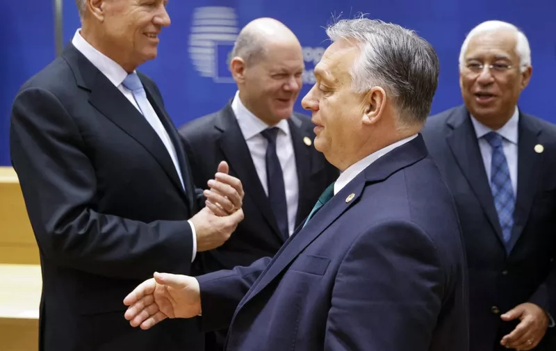 Romania's President Klaus Werner Iohannis (L), Germany's Chancellor Olaf Scholz, and Portugal's Prime Minister Antonio Costa (4thL) react next to Hungary's Prime Minister Viktor Orban (3rdL) prior to the start of a European Council meeting at the European headquarters in Brussels, on February 1, 2024. EU leaders are to gather in Brussels on February 1, 2024, for a meeting of the European Council, where they will discuss aid to Ukraine as the war nears its second anniversary. (Photo by Ludovic MARIN / AFP)