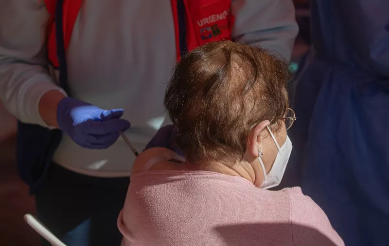 February 15, 2021, Seville (Andalusia, Madrid, Spain: A woman over 90 years old receives the Pfizer vaccine against Covid-19, in a tent set up in the esplanade of the health center of the municipality of Lora del RÃ­o. In Seville (Andalusia, Spain), 15 February 2021...15 FEBRUARY 2021..MarÃ­a JosÃ© LÃ³pez / Europa Press..02/15/2021,Image: 591136555, License: Rights-managed, Restrictions: * France, Germany , UK and Spain Rights OUT *, Model Release: no