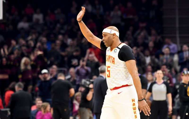 CLEVELAND, OHIO - FEBRUARY 12: Vince Carter #15 of the Atlanta Hawks reacts after being honored by the Cleveland Cavaliers during the first half at Rocket Mortgage Fieldhouse on February 12, 2020 in Cleveland, Ohio. NOTE TO USER: User expressly acknowledges and agrees that, by downloading and/or using this photograph, user is consenting to the terms and conditions of the Getty Images License Agreement. (Photo by Jason Miller/Getty Images)