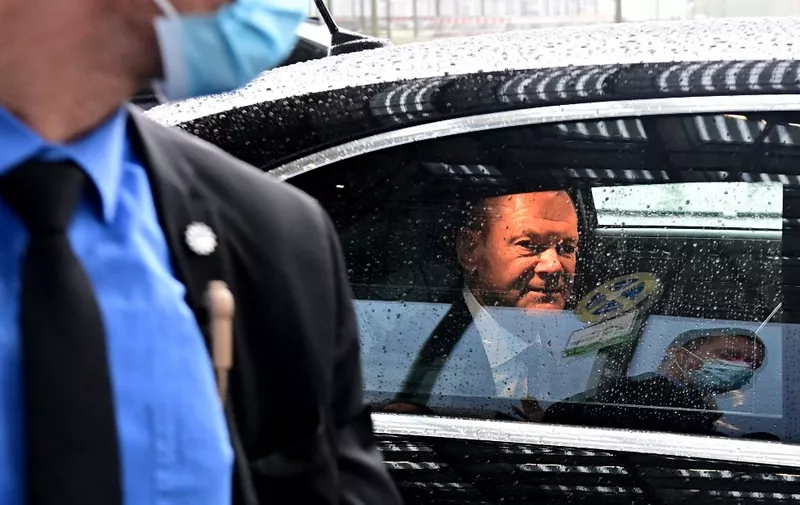 German Finance Minister, Vice-Chancellor and the Social Democratic SPD Party's candidate for chancellor Olaf Scholz sits in a car as he leaves after a meeting with his party's parliamentary group on September 29, 2021 in Berlin. (Photo by Tobias SCHWARZ / AFP)
