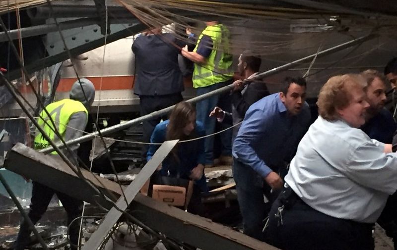 HOBOKEN, NJ - SEPTEMBER 29: Passengers rush to safety after a NJ Transit train crashed in to the platform at the Hoboken Terminal September 29, 2016 in Hoboken, New Jersey.   Pancho Bernasconi/Getty Images/AFP