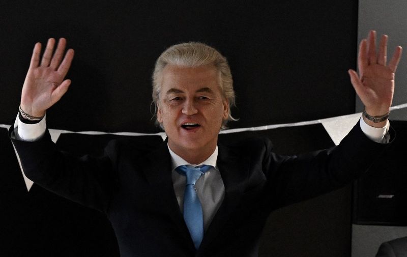 Leader of the Party for Freedom (PVV) Geert Wilders waves as he arrives at a post-election meeting at the Nieuwspoort conference center in The Hague on November 23, 2023. Far-right firebrand Geert Wilders faced an uphill struggle on November 23, 2023 to woo rivals for a coalition government after a "monster victory" in Dutch elections that shook the Netherlands and Europe. His PVV (Freedom Party) won 37 seats in parliament, more than doubling his share from the last election and outstripping opponents, according to near complete results. (Photo by JOHN THYS / AFP)