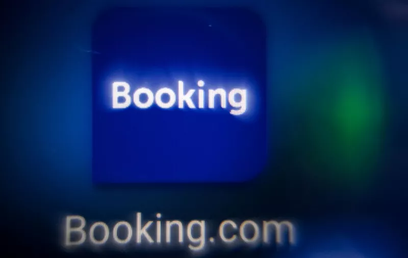 This picture taken in Moscow on November 11, 2021 shows the logo of the online reservation platform Booking.com on a tablet screen. (Photo by Kirill KUDRYAVTSEV / AFP)
