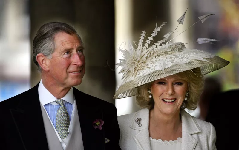 Prince Charles and the Duchess of Cornwall, formerly Camilla Parker Bowles, leave the Guildhall where they were married in a private ceremony 09 April 2005.  Prince Charles and his longtime sweetheart Camilla Parker Bowles married today after two months of muddled preparations and a lifetime of waiting.   AFP PHOTO/ADRIAN DENNIS (Photo by Adrian DENNIS / AFP)
