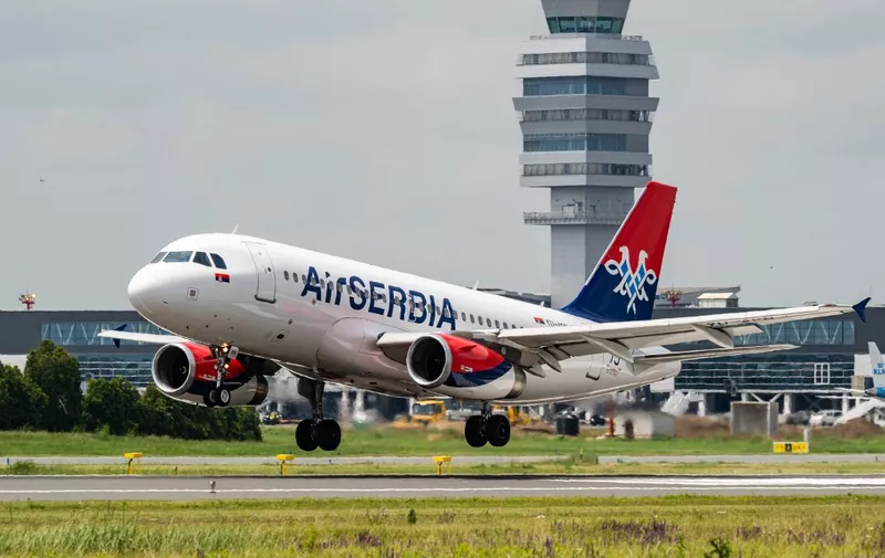 This photograph taken on June 7, 2023, shows an Air Serbia Airbus A319 aircraft landing at the newly opened runway of Belgrade Nikola Tesla airport. The opening of Belgrade airport's new runway marked the completion of one of the major infrastructure projects undertaken by French operator Vinci, since taking over the concession in late 2018. (Photo by Andrej ISAKOVIC / AFP)