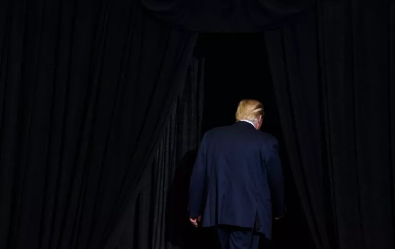 HUNTINGTON, WV - AUGUST 03: President Donald J. Trump walks off the stage after his campaign rally at the Big Sandy Superstore Arena on August 3, 2017 in Huntington, West Virginia.   Justin Merriman/Getty Images/AFP