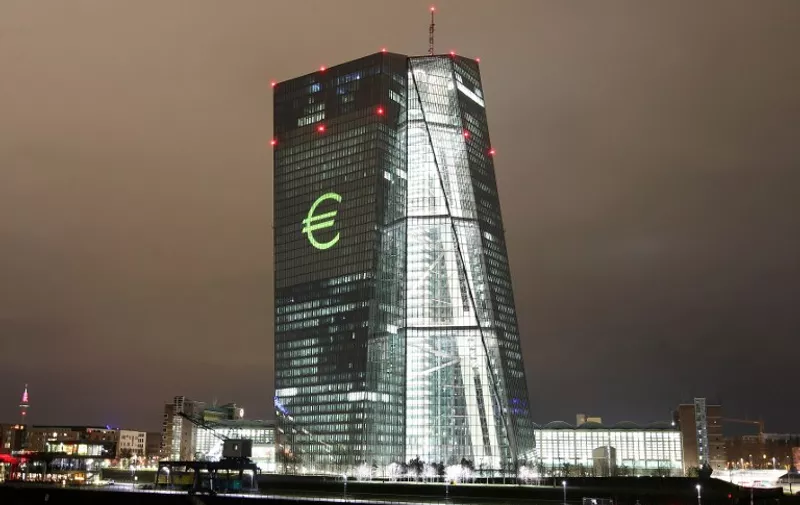 The Euro-logo is projected onto the main building of the European Central Bank, ECB during a rehearsal of the "Luminale" in Frankfurt/Main, Germany, on March 12, 2016.
The light festival "luminale" runs from March 13 to 18, 2016.  / AFP PHOTO / DANIEL ROLAND