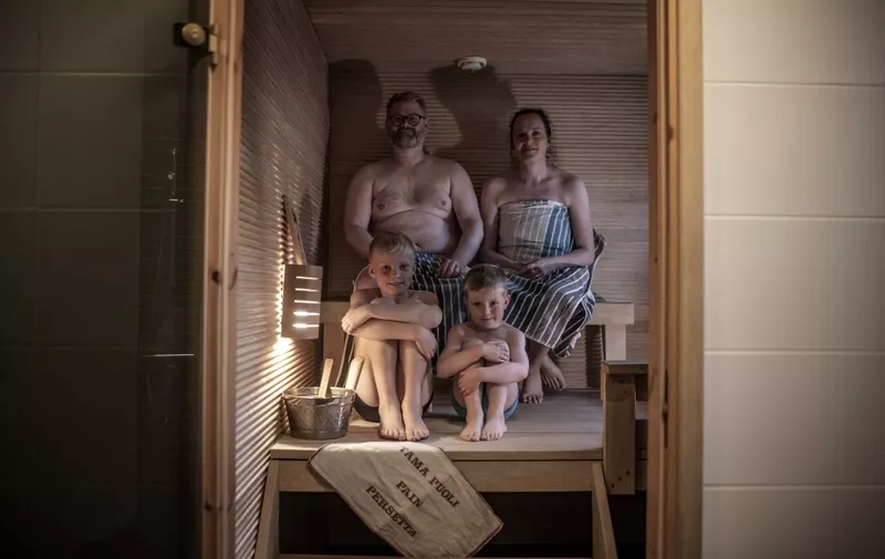 Tomas Stahl, a 43-year-old Finn (Top Left), his wife Jaana Stahl, 38 (Top R), and their sons Noa, 9, and Urho, 5, Bottom R pose in their home Sauna in Vaasa on September 10, 2022. - Finns are being urged to turn down their thermostats this winter, take shorter showers and spend less time in their beloved saunas, as Europe faces an energy crunch following Russia's war in Ukraine.
The nationwide power saving campaign was announced this week Russia has cut gas supplies to Finland and other European countries in recent months, causing energy prices to soar.
Called "A degree lower", the campaign will be launched on October 10, Kati Laakso, a spokeswoman at state-owned company Motiva which promotes sustainability, (Photo by Olivier MORIN / AFP)