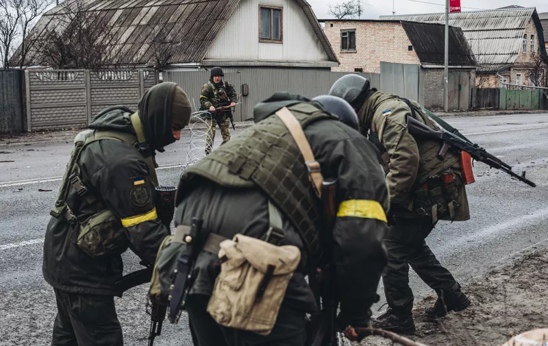 March 4, 2022, Horenka, Spain: Ukrainian army soldiers put up a barbed wire fence, March 4, 2022, at March 4, 2022, in Horenka, Ukraine. Ukraine has been embroiled in a war for nine days following the start of attacks by Russia on February 24. In the early hours of last night, Russia took control of the Zaporiyia nuclear power plant, the largest in Europe, whose fire has already been extinguished without casualties. Another of the latest attacks has been in the north of Ukraine, in Chernobyl, which has raised the death toll to 47, the deadliest offensive since the first day of the invasion.  The balance of the war, according to the latest information from both the Ukrainian government and UNHCR, is at least 2,000 civilians dead and about one million refugees who have fled Ukraine...04 MARCH 2022;WAR;RUSSIA;UKRAINE;RUSSIAN INVASION;NINTH DAY;ATTACK;AIRPLANES..Diego Herrera / Europa Press..03/04/2022,Image: 666366468, License: Rights-managed, Restrictions: * Spain Rights OUT *, Model Release: no, Credit line: Profimedia