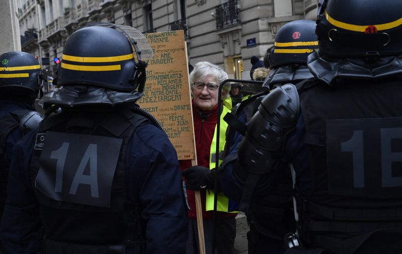5744999 29.12.2018 French riot police guard an area during "yellow vests" movement rally, in Paris, France., Image: 404652113, License: Rights-managed, Restrictions: , Model Release: no, Credit line: Profimedia, Sputnik
