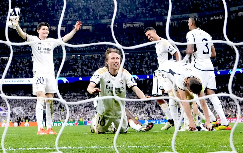 Real Madrid's Luka Modric, second left, celebrates at the end of the Champions League semifinal second leg soccer match between Real Madrid and Bayern Munich at the Santiago Bernabeu stadium in Madrid, Spain, Wednesday, May 8, 2024. (AP Photo/Manu Fernandez)
