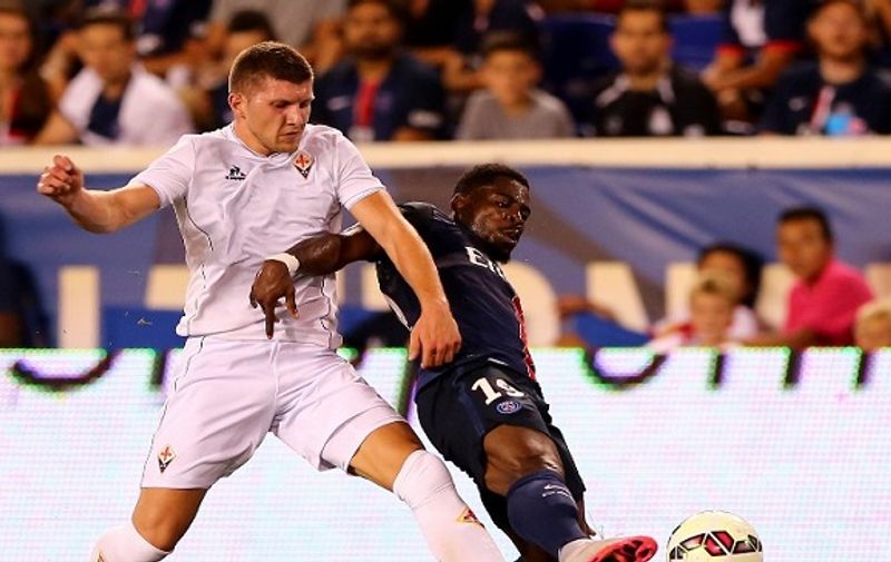 HARRISON, NJ - JULY 21: Ante Rebic #11 of ACF Fiorentina and Serge Aurier #19 of Paris Saint-Germain fight for the ball in the first half during the International Champions Cup at Red Bull Arena on July 21, 2015 in Harrison, New Jersey.   Elsa/Getty Images/AFP