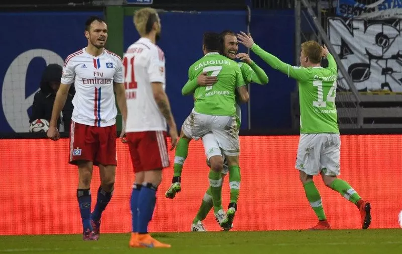 (R-L) Wolfsburg&#8217;s Belgian midfielder Kevin De Bruyne, Wolfsburg&#8217;s Croatian midfielder Ivan Perisic and Wolfsburg&#8217;s midfielder Daniel Caligiuri celebrate after scoring during the German first division Bundesliga football match Hamburger SV vs VfL Wolfsburg in Hamburg, northern Germany, on April 11, 2015. AFP PHOTO / RESTRICTIONS &#8211; DFL RULES TO LIMIT THE ONLINE USAGE DURING MATCH [&hellip;]
