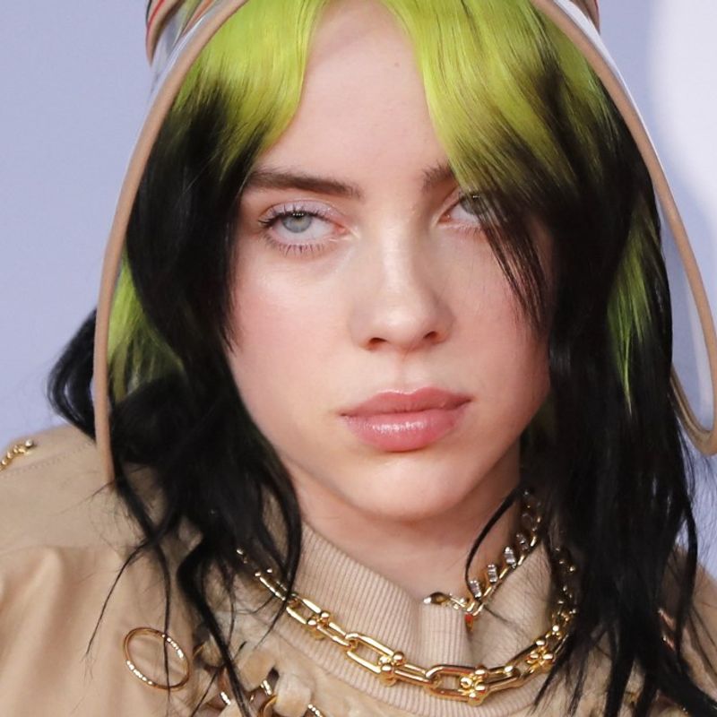 US singer-songwriter Billie Eilish poses on the red carpet on arrival for the BRIT Awards 2020 in London on February 18, 2020. (Photo by Tolga AKMEN / AFP) / RESTRICTED TO EDITORIAL USE  NO POSTERS  NO MERCHANDISE NO USE IN PUBLICATIONS DEVOTED TO ARTISTS