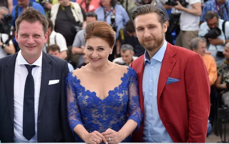 (From L) Croatian director Dalibor Matanic, Croatian actress Nives Ivankovic and Croatian actor Goran Markovic pose during a photocall for the film "Zvizdan" (The High Sun) at the 68th Cannes Film Festival in Cannes, southeastern France, on May 17, 2015.      AFP PHOTO / BERTRAND LANGLOIS