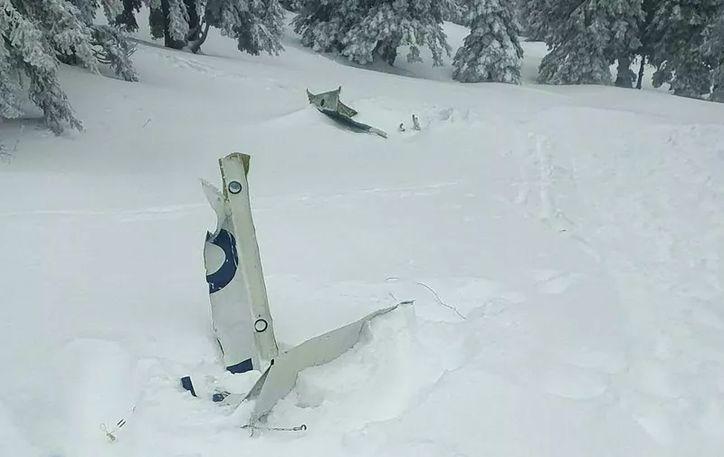 This photo taken on November 25, 2023 shows plane debris of a small plane that crashed at Kasberg Mountain, Gruenau im Almtal, Upper Austria. Austrian police said on November 25 that the bodies of four people were recovered after a plane crashed in western Austria. A large-scale search operation was launched after plane debris was found in the mountainous area, which had seen heavy snowfall. (Photo by FEUERWEHR DROHNENGRUPPE KIRCHDORF / various sources / AFP) / Austria OUT