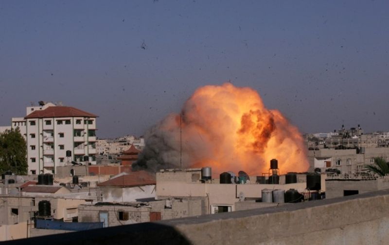 A picture taken on August 26, 2014 shows a ball a fire rising from the house of Palestinian Islamic Jihad leader, Nafez Azzam, that was hit by an Israeli air strike in Rafah in the southern of Gaza Strip. The Palestinians said they had reached agreement with Israel on a "permanent" halt to seven weeks of bloodshed in and around Gaza although Israel was silent on the claimed deal. AFP PHOTO / SAID KHATIB