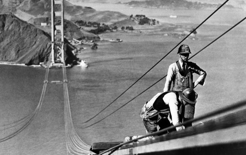 Picture dated October 1935 of the Golden Gate bridge, in the San Francisco Bay, during its construction. Construction began on 05 January 1933 and the bridge was inaugurated 27 May 1937 by Franklin Delano Roosevelt, who pushed a button in Washington, DC, signaling the official start of vehicle traffic over the Bridge. Idea of the engineer Joseph Strauss, it was the largest suspension bridge in the world.