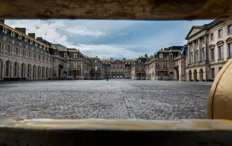 A picture taken on May 17, 2021 shows the main entrance of the Chateau de Versailles (Palace of Versailles) in Versailles, near Paris, ahead of its opening on May 19, as part of the easing up of the measure adopted to curb the spread of the Covid-19 in France. (Photo by Martin BUREAU / AFP)