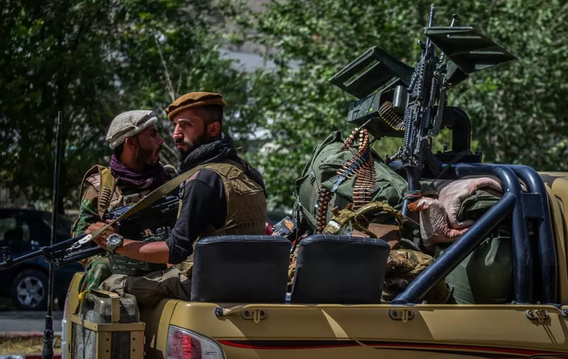 Soldiers from Afghan Security forces travel on a armed vehicle along a road in Panjshir province of Afghanistan on August 15, 2021. (Photo by Ahmad SAHEL ARMAN / AFP)