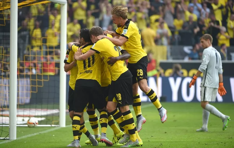 Dortmund's players react after  the German first division Bundesliga football match Borussia Dortmund vs Hertha BSC in Dortmund, Germany, on August 30, 2015.  AFP PHOTO / PATRIK STOLLARZ
RESTRICTIONS: DURING MATCH TIME: DFL RULES TO LIMIT THE ONLINE USAGE TO 15 PICTURES PER MATCH AND FORBID IMAGE SEQUENCES TO SIMULATE VIDEO. 
== RESTRICTED TO EDITORIAL USE ==
FOR FURTHER QUERIES PLEASE CONTACT DFL DIRECTLY AT + 49 69 650050.