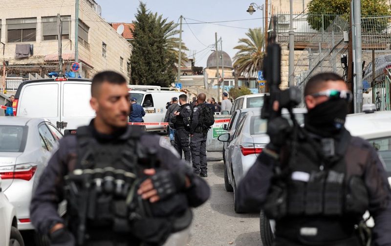 Israeli security forces gather in Jerusalem's predominantly Arab neighbourhood of Silwan, where an assailant reportedly shot and wounded two people, on January 28, 2023. - An assailant shot and wounded two people in east Jerusalem today, Israeli medics said, hours after a Palestinian gunman killed seven outside a synagogue in one of the deadliest such attacks in years. Police said the suspect was "neutralised" following the gun attack in the Silwan neighbourhood, just outside Jerusalem's old, walled city. (Photo by AHMAD GHARABLI / AFP)