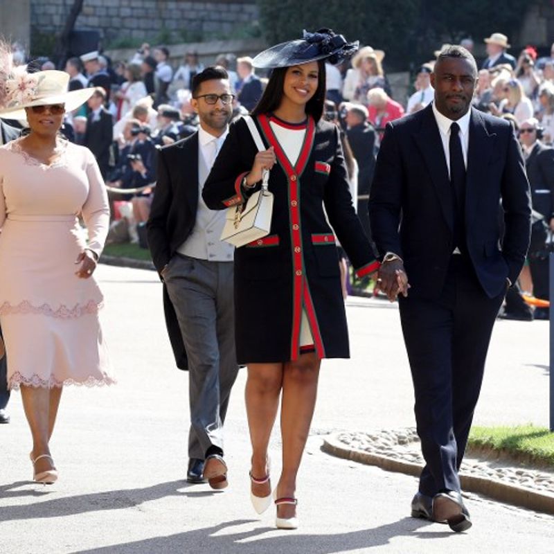 British actor Idris Elba (R) arrives with his fiancee Sabrina Dhowre (2R) followed by Prince's Harry's friend, British singer James Blunt (L) and US talk show host Oprah Winfrey (2L) for the wedding ceremony of Britain's Prince Harry, Duke of Sussex and US actress Meghan Markle at St George's Chapel, Windsor Castle, in Windsor, on May 19, 2018. / AFP PHOTO / POOL / Chris Radburn