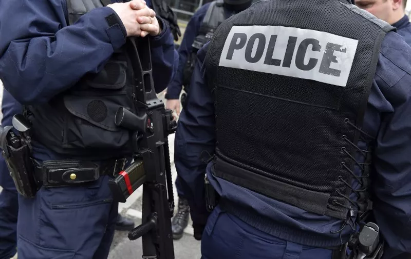 French Police officers secure the area before the suspects in the murder of the French Troadec family of four, arrive at the Nantes courthouse in an unmarked police car on March 6, 2017, to be presented before an investigating judge.    
The brother-in-law of a Frenchman who went missing with his wife and two children more than a fortnight ago  has admitted killing all four family members, the Nantes prosecutor said on march 6 in a case thought to centre on a dispute over an inheritance. / AFP PHOTO / LOIC VENANCE / The erroneous mention[s] appearing in the metadata of this photo by LOIC VENANCE has been modified in AFP systems in the following manner: [the French Troadec family] instead of [a French family of four]. Please immediately remove the erroneous mention[s] from all your online services and delete it (them) from your servers. If you have been authorized by AFP to distribute it (them) to third parties, please ensure that the same actions are carried out by them. Failure to promptly comply with these instructions will entail liability on your part for any continued or post notification usage. Therefore we thank you very much for all your attention and prompt action. We are sorry for the inconvenience this notification may cause and remain at your disposal for any further information you may require.