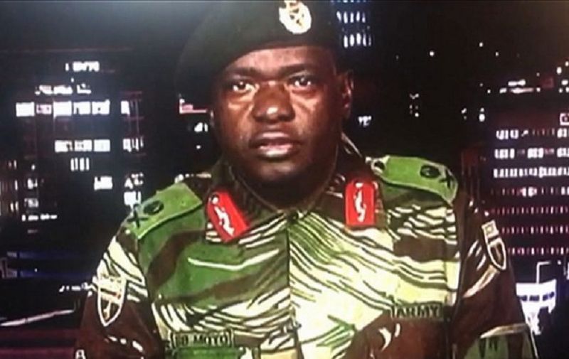 This screen grab taken early on November 15, 2017 from a television broadcast on the Zimbabwe Broadcasting corporation (ZBC) shows Zimbabwe Major General Sibusiso Moyo reading a statement at the ZBC broadcast studio in Harare.
Zimbabwe's military appeared to be in control of the country on November 15 as generals denied staging a coup but used state television to vow to target "criminals" close to President Robert Mugabe. / AFP PHOTO / Dewa MAVHINGA